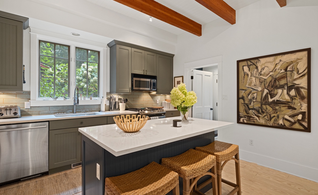 Three can sit at the bar and watch you host your own cooking show. What's on the menu?