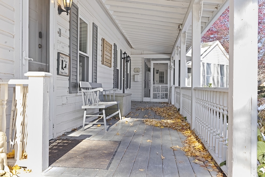 The Farmhouse porch invites you to linger, breathe, and unwind.