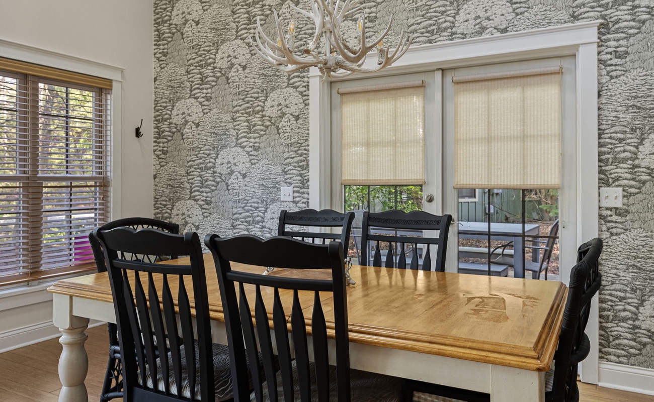 The dining table seats six; the screened-in porch has plenty more places to sit.