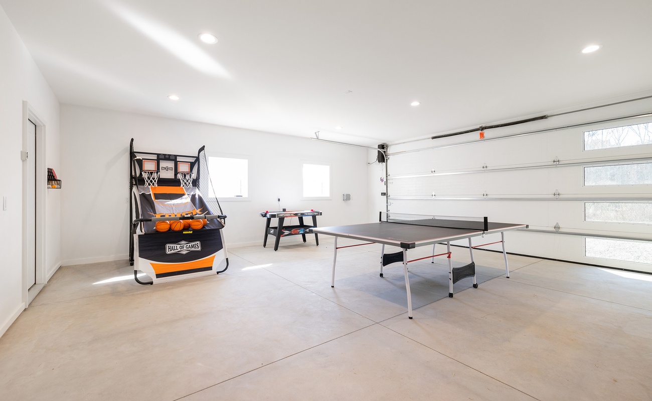 Challenge friends to basketball and ping pong in this bright game space.