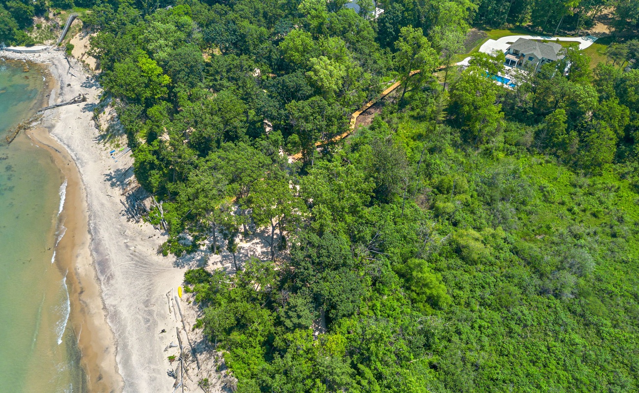 A perfect blend of sand, sea, and trees captured from the sky.