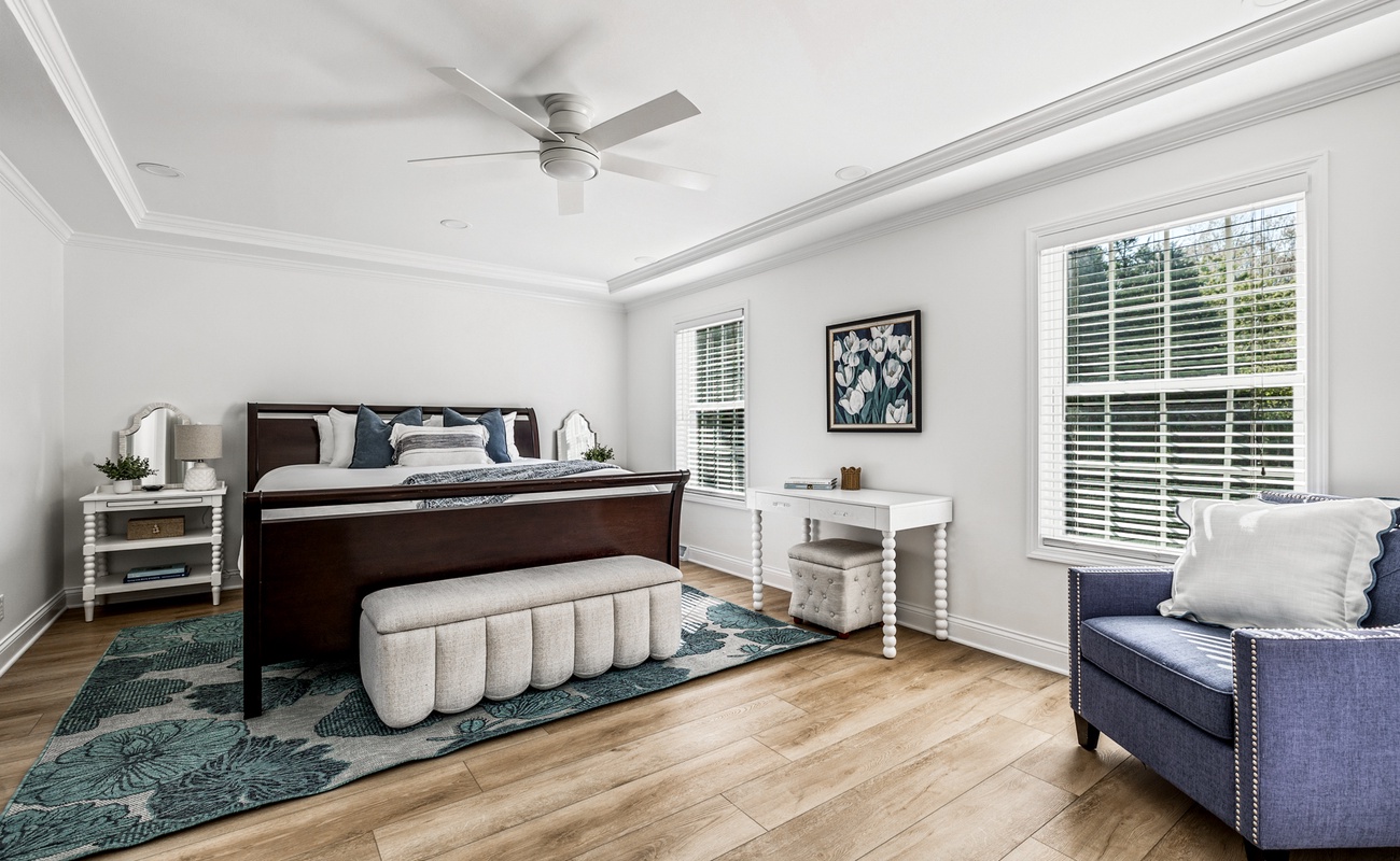 Primary bedroom is on the main level & has a king-size bed.