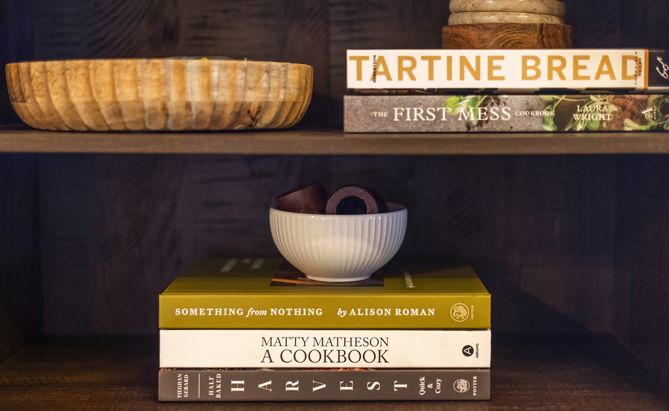 Inspiring cookbooks and serving pieces for cabin dinners.
