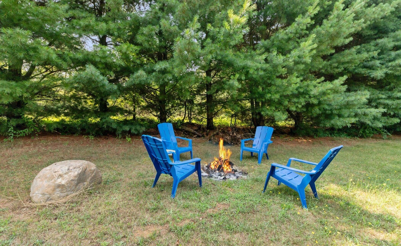 Gather around your private fire pit with comfy Adirondacks.