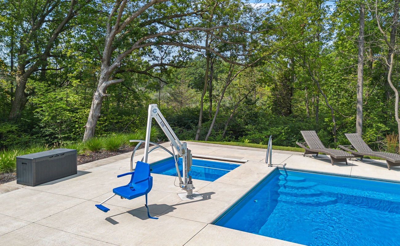 Enjoy the excitement of making a splash right in your own backyard! Another accessible feature for the pool area is the lift by the tub and the pool.