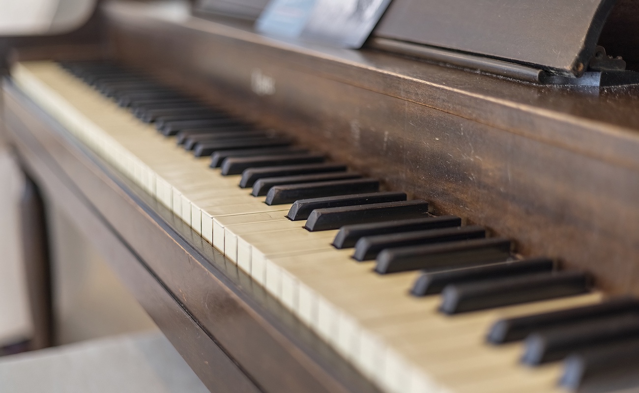 Play music on our piano as evenings slow down and the house settles in.