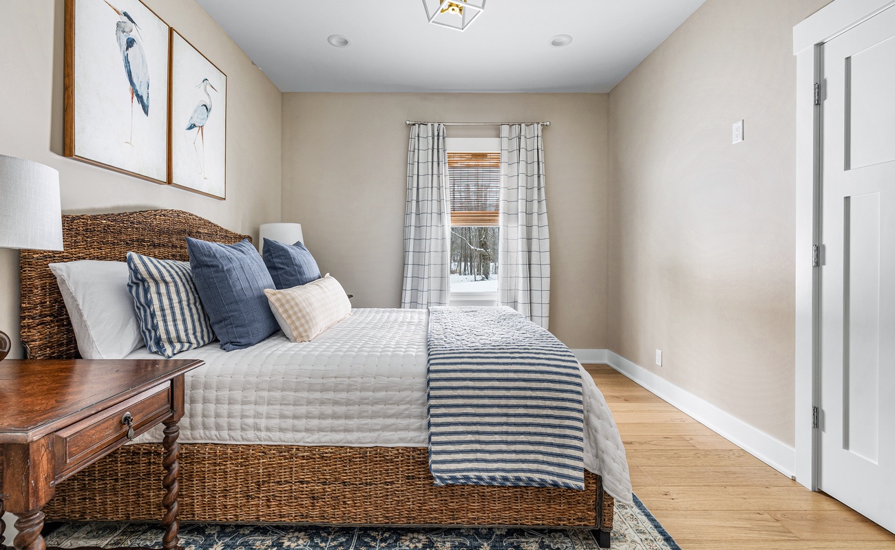 Bedroom 2 is on the main level & has a queen-size bed.