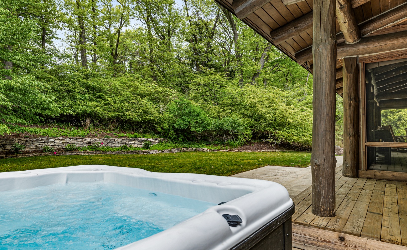 Dip into warm soak in the hot tub, surrounded by the beauty of the woods.