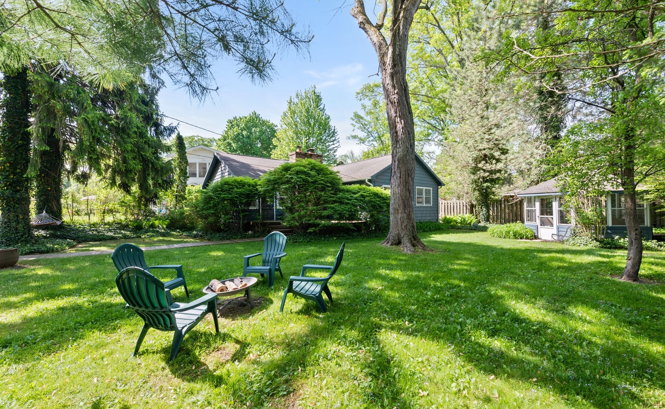 Cozy up in the evenings by the backyard fire pit.