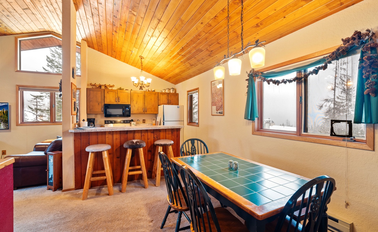 Gather around the table and let the good times roll in this inviting space.