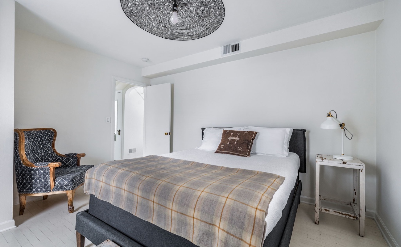 Bedroom 2 is on the main level & has a queen-size bed.