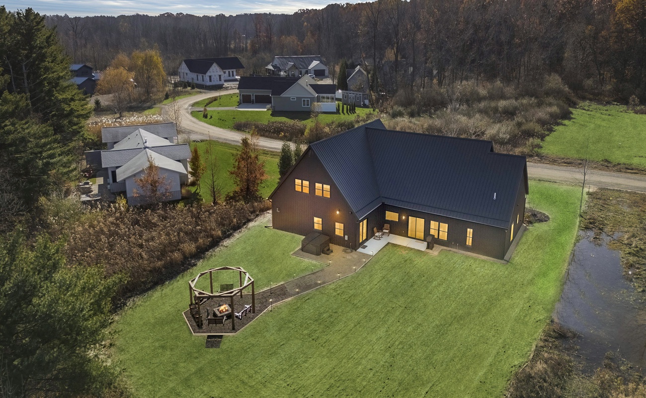 Peaceful Harbert retreat where evenings glow softly around the fire.