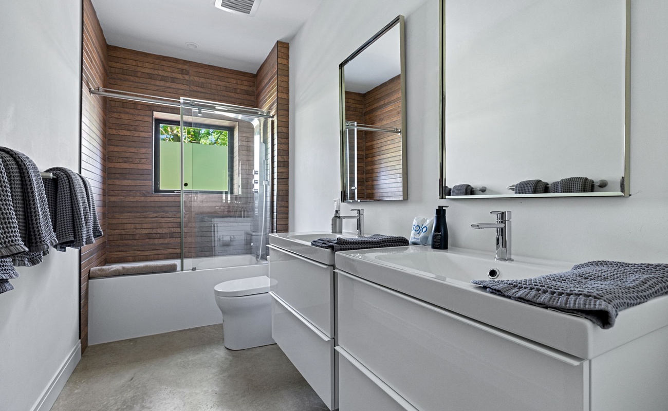 Crisp whites and wood accents—because bathrooms deserve style too.