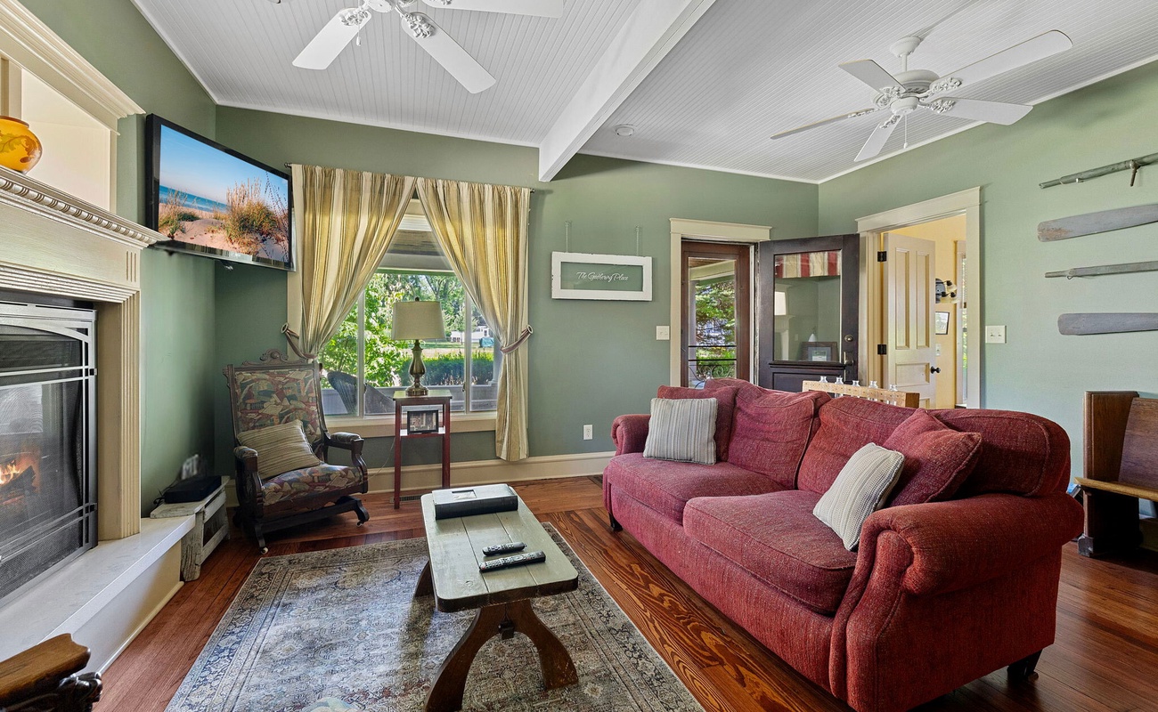 Relax and unwind in this inviting living room filled with natural light.