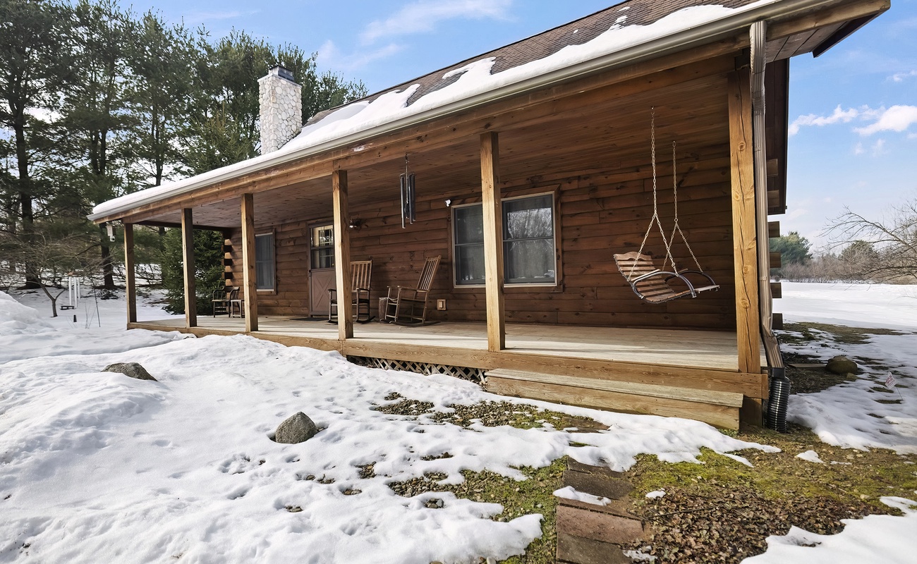 A classic covered porch with a swing = your ideal country getaway.