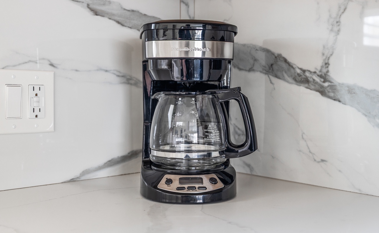 Your morning savior, standing by with a fresh pot and zero judgment.