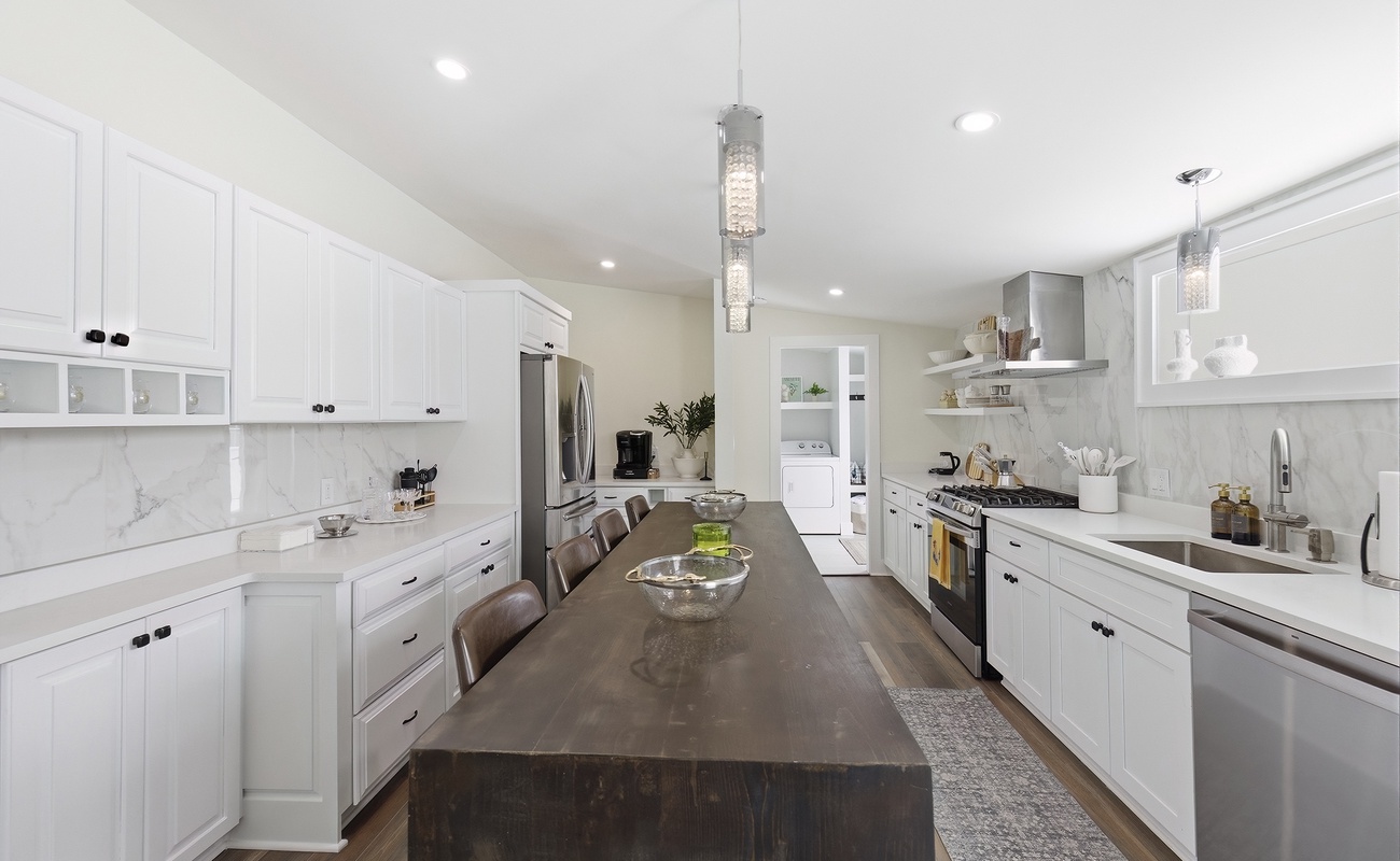 A long central island runs through the heart of the kitchen.