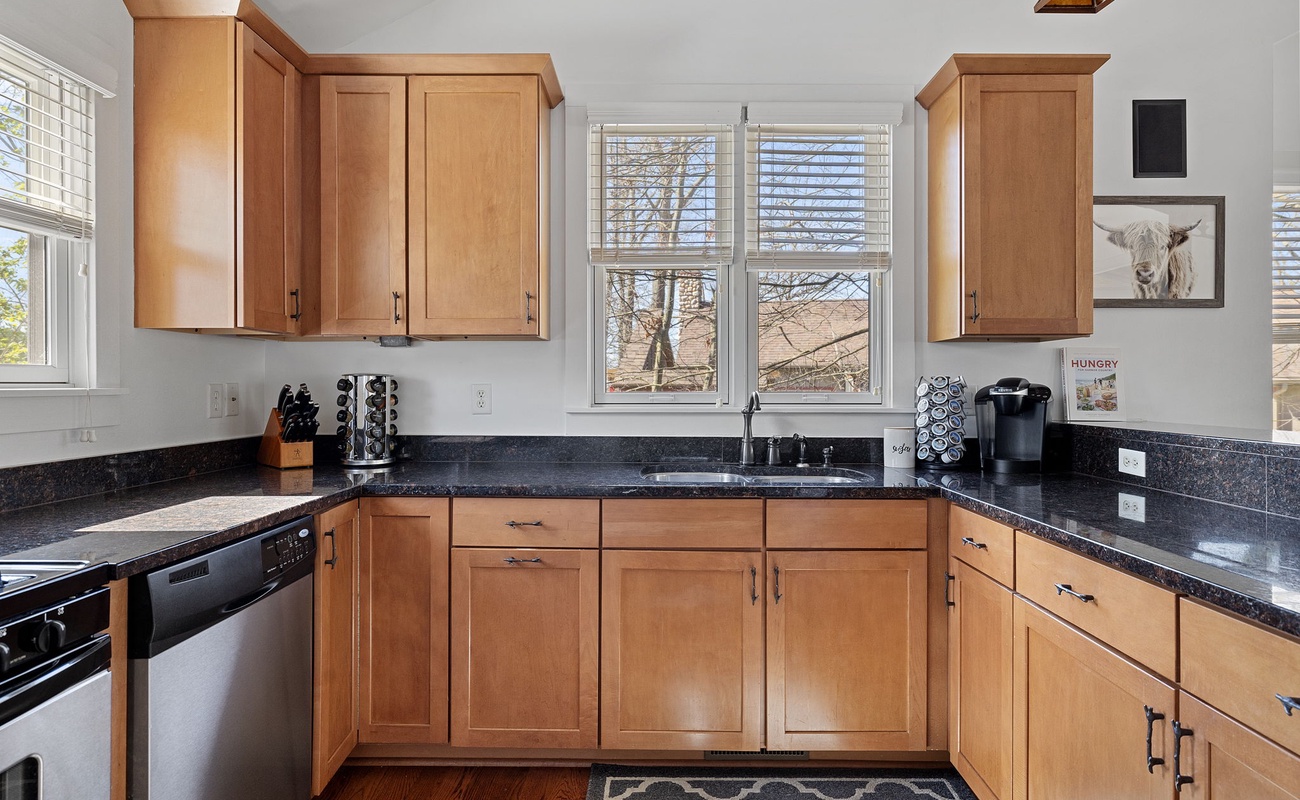 The kitchen's wraparound granite countertop space is great for large meal prep.