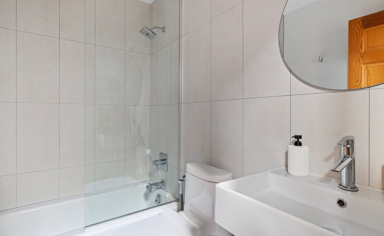 The second full bath is downstairs and has a shower/tub combo.