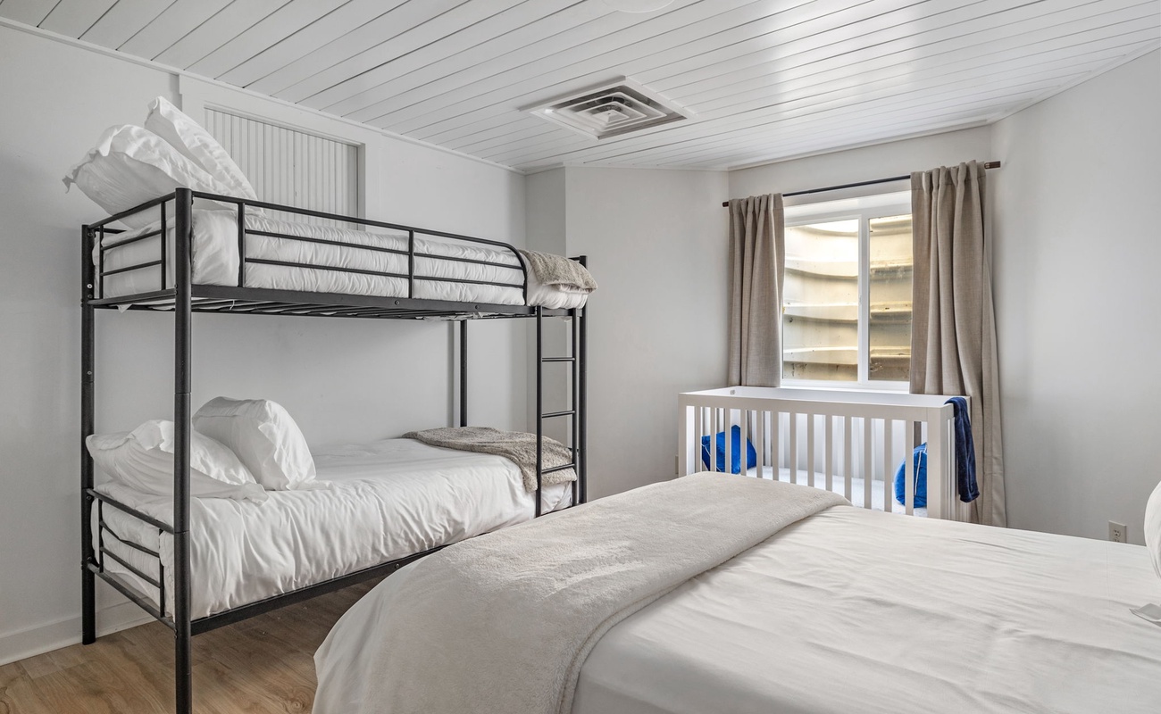 Bedroom 7 is on the lower level & has king-size bed, twin-size bunkbed and a crib.