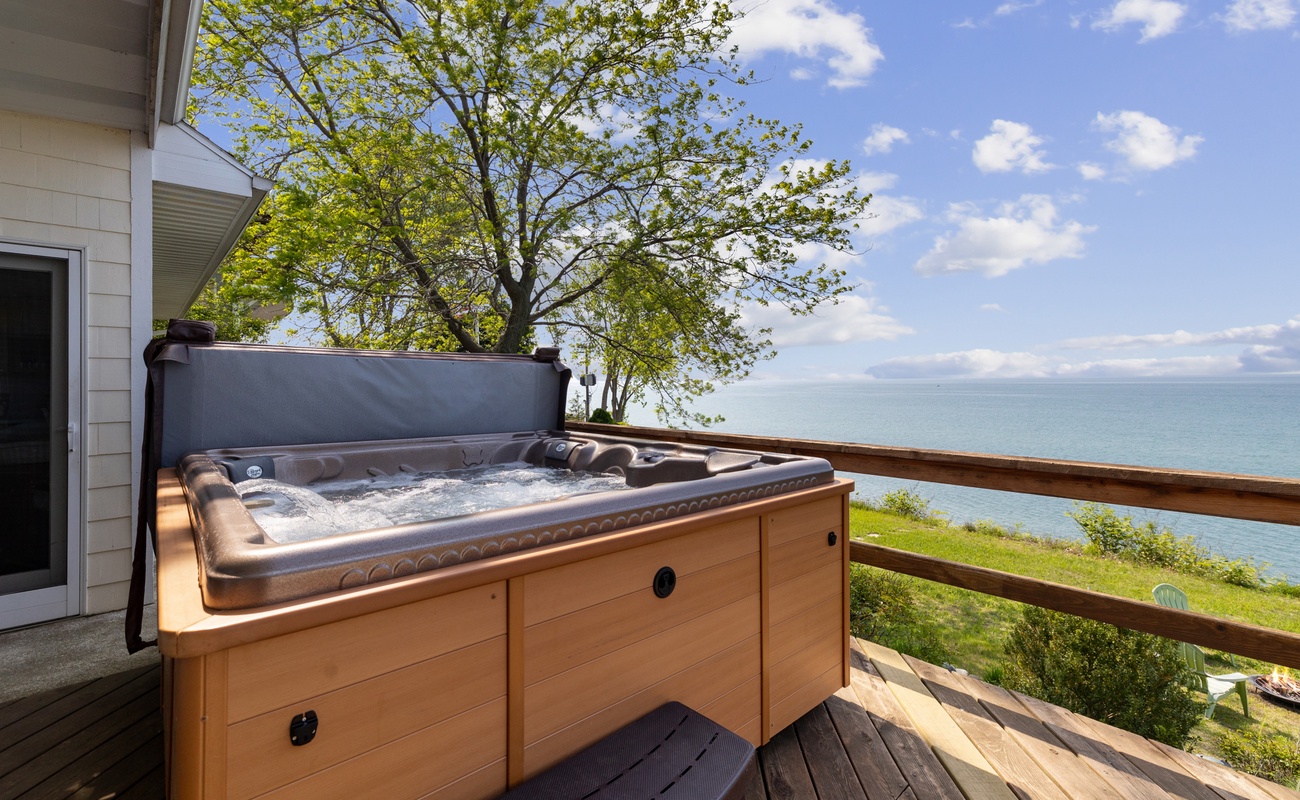 The hot tub and back deck boast breathtaking views of Lake Michigan.