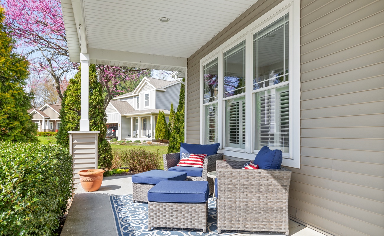 Relax in style with breezy seating and peaceful neighborhood views.
