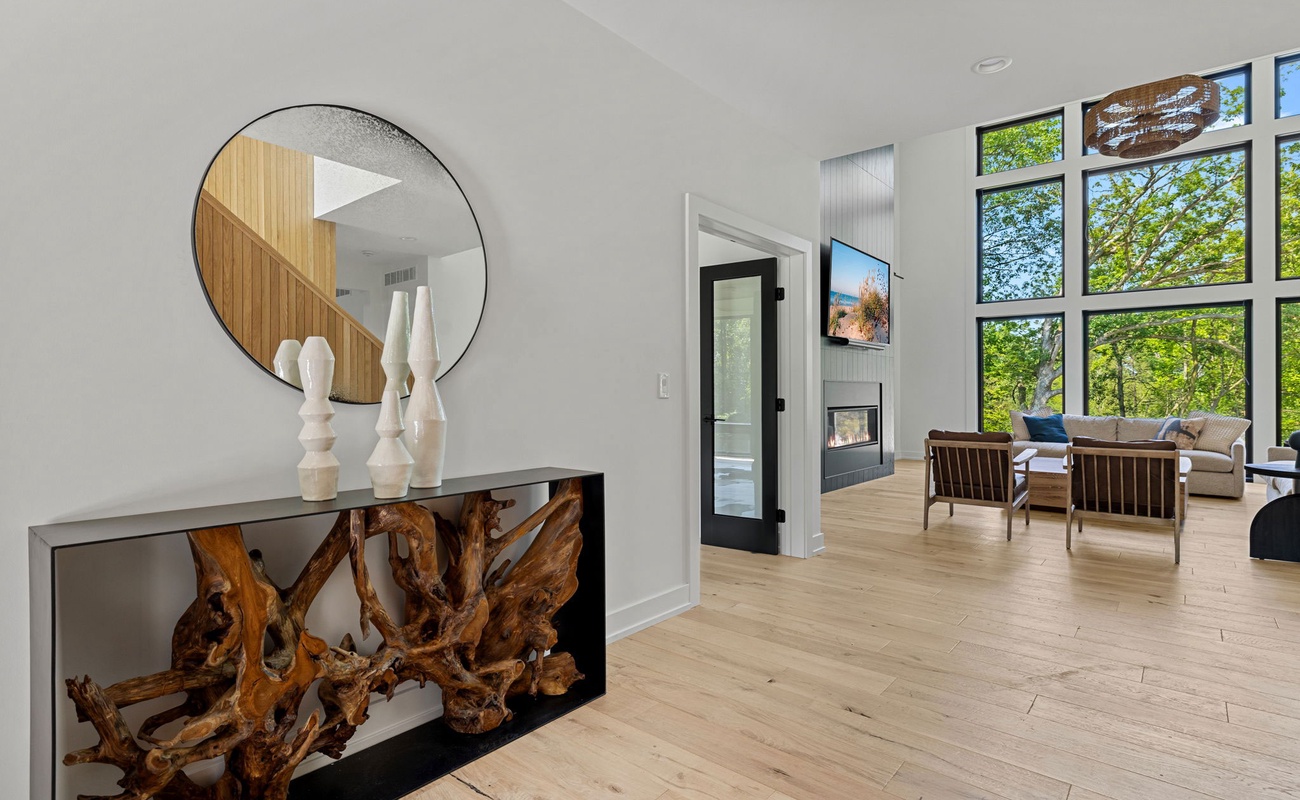 Embracing the beauty of natural light and warm wooden floors in this modern living room.