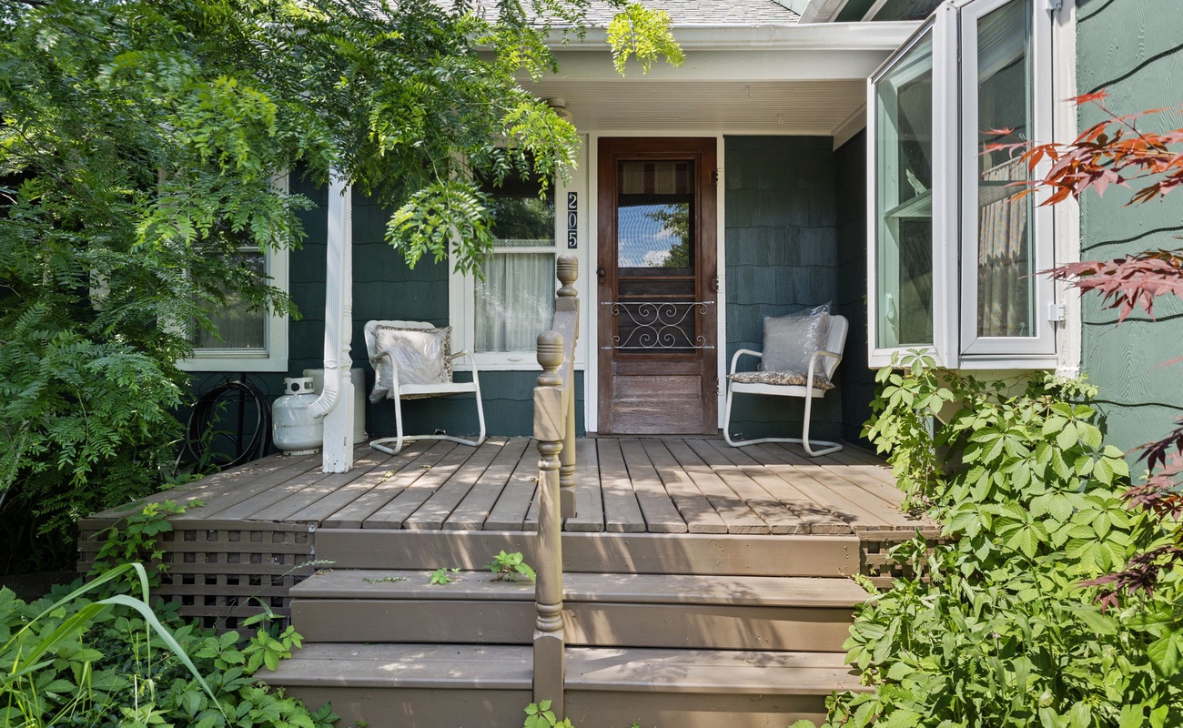 Enjoy tranquil mornings and peaceful evenings on this charming porch.