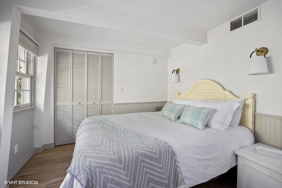 Bedroom 3 is on the main level & has a queen-size bed.