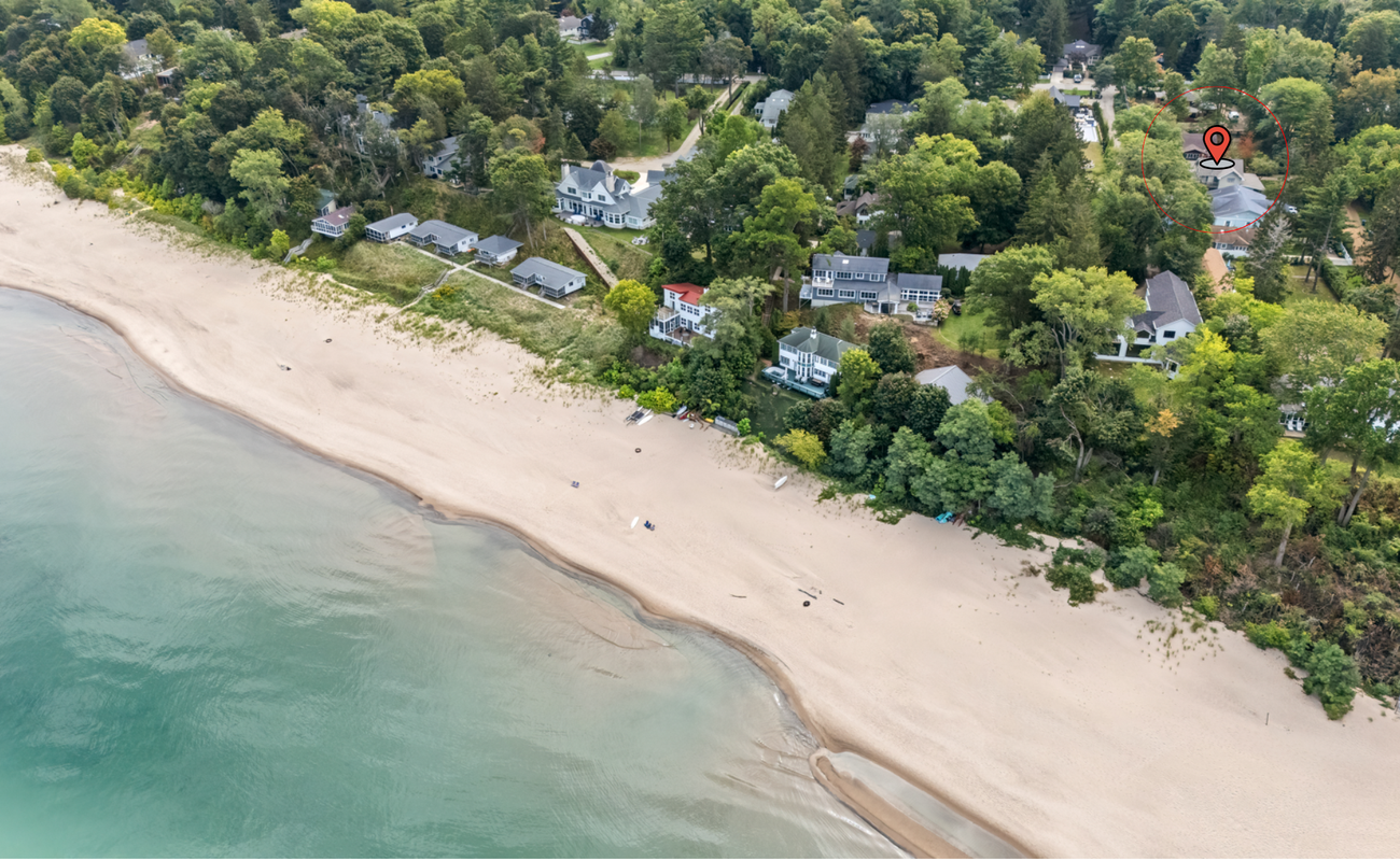 Steps to the beach! Beachside retreat surrounded by lush trees and colorful blooms.