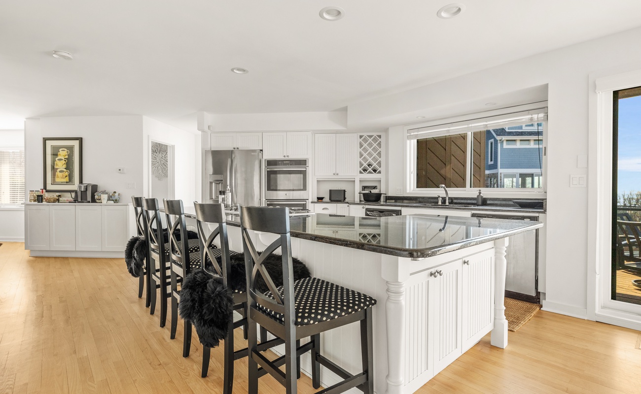 This extra-wide stone-top center island has room with a view - of Lake Michigan!