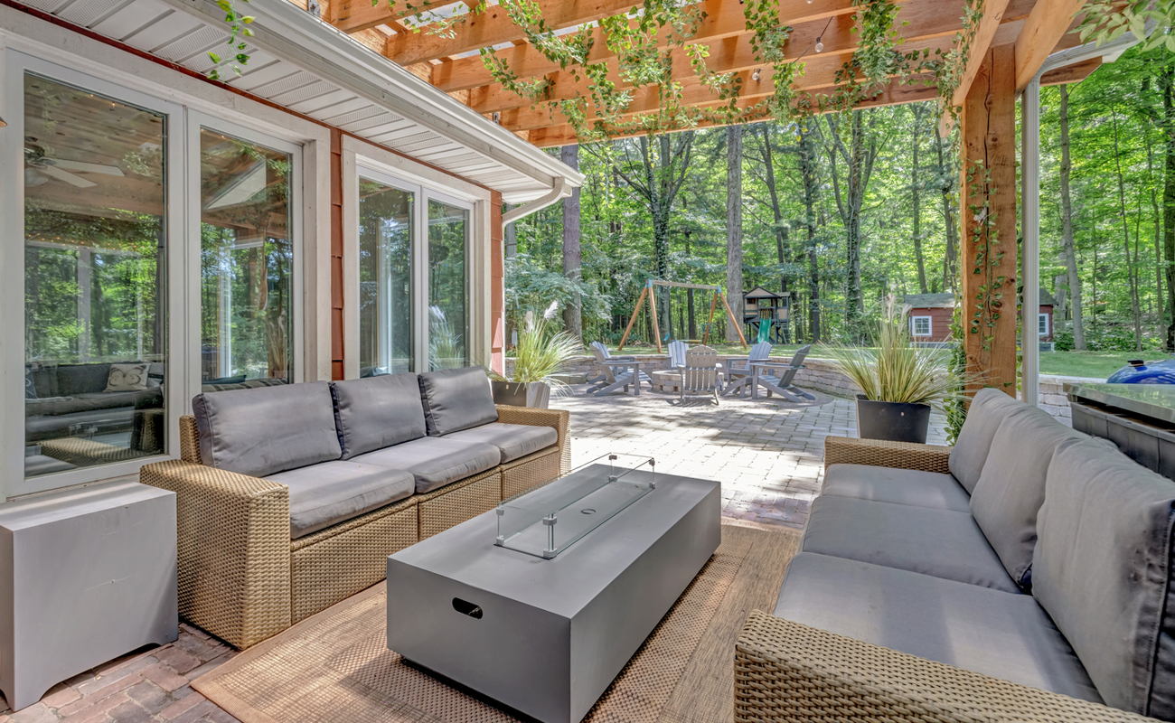 Dine, sip, or unwind in this shaded outdoor haven under the pergola.