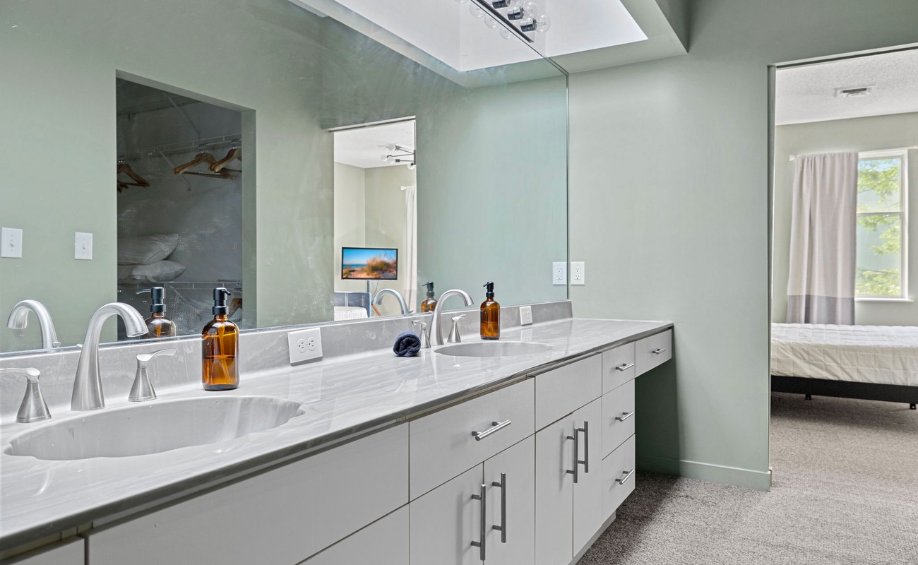 Morning routines are made easy with this sleek double vanity!
