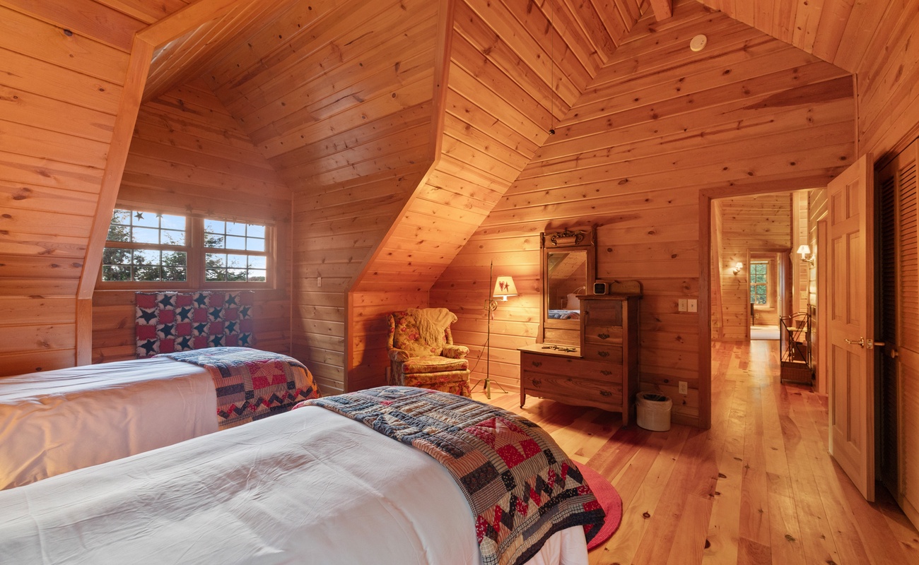 Gotta' love the vaulted wood ceilings and color-coordinated quilts and artwork.