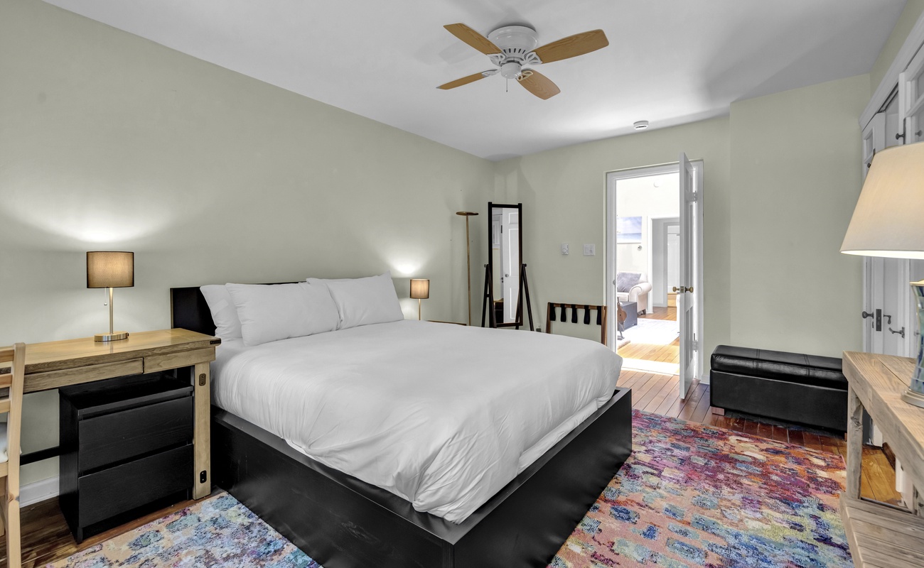 Primary bedroom is on the main level & has a queen-sized bed.