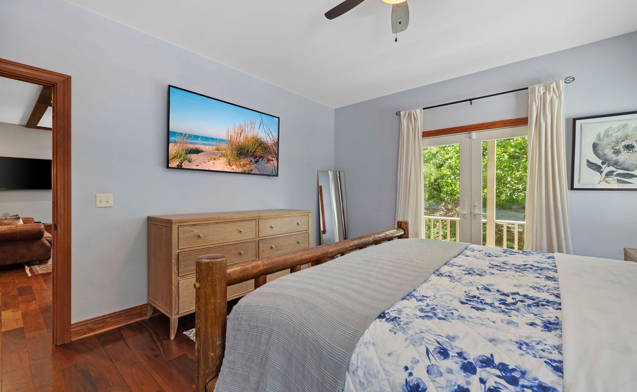 Enjoy bright views through double doors leading to a peaceful balcony.