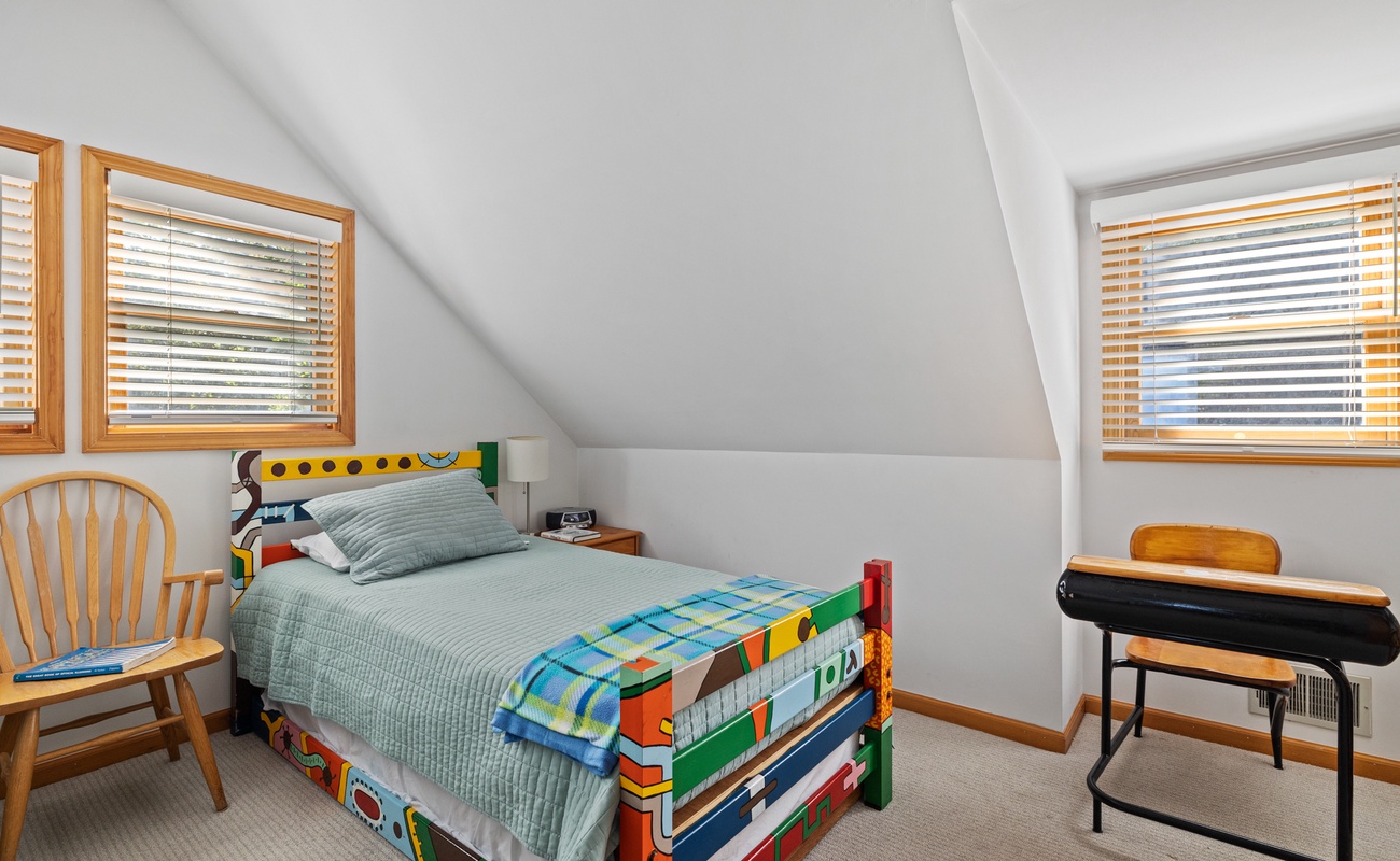 One of the two spunky colorful twin beds.