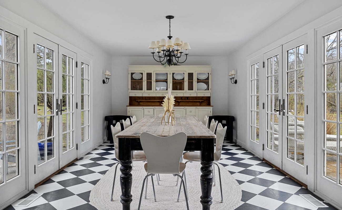 The elegant, beautifully-lit formal dining room comfortably seats eight.