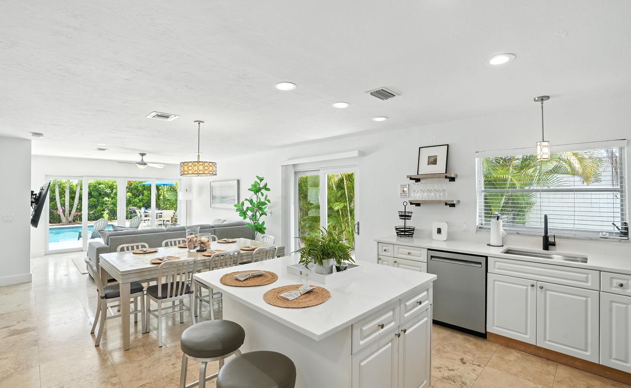 Cook, dine, and unwind with pool views all around.