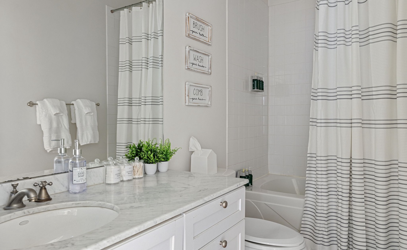 Freshen up in style with this elegant and serene bathroom space