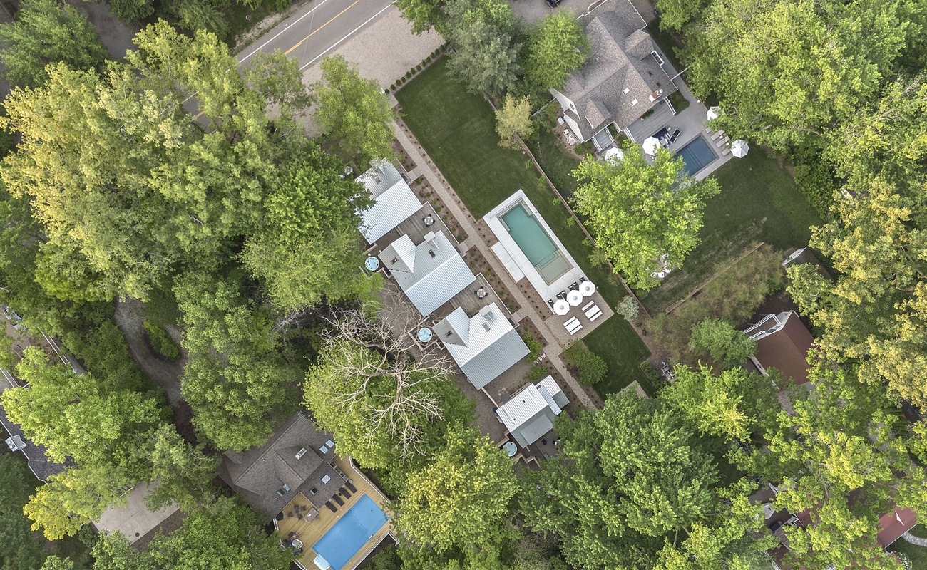 This aerial shot showcases a beautiful home with a pool that’s calling for summer days and pool parties.