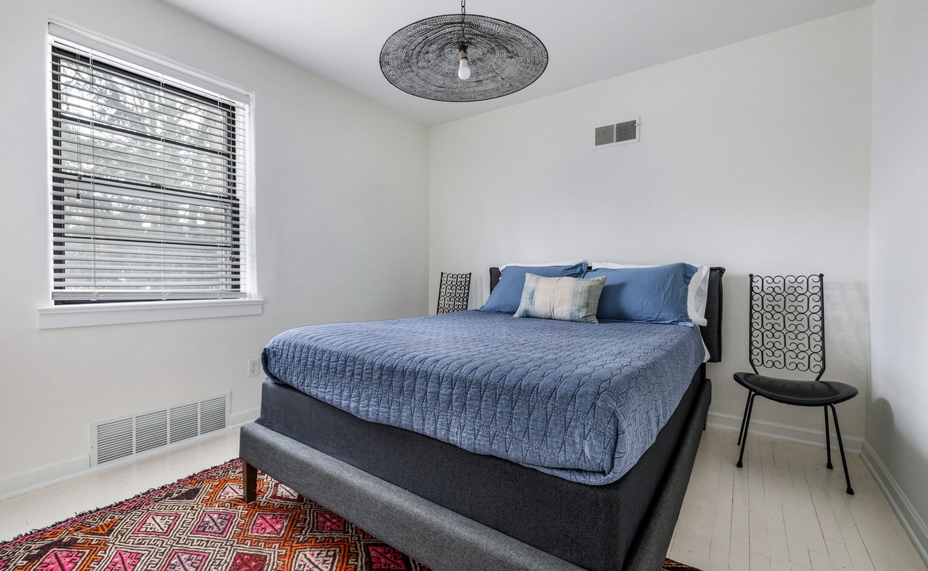 Primary bedroom is on the main level & has a queen-size bed.