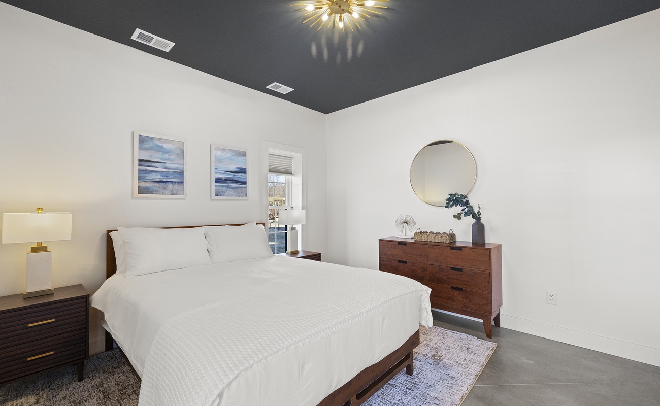 Calming bedroom escape where natural light and comfort take the lead.