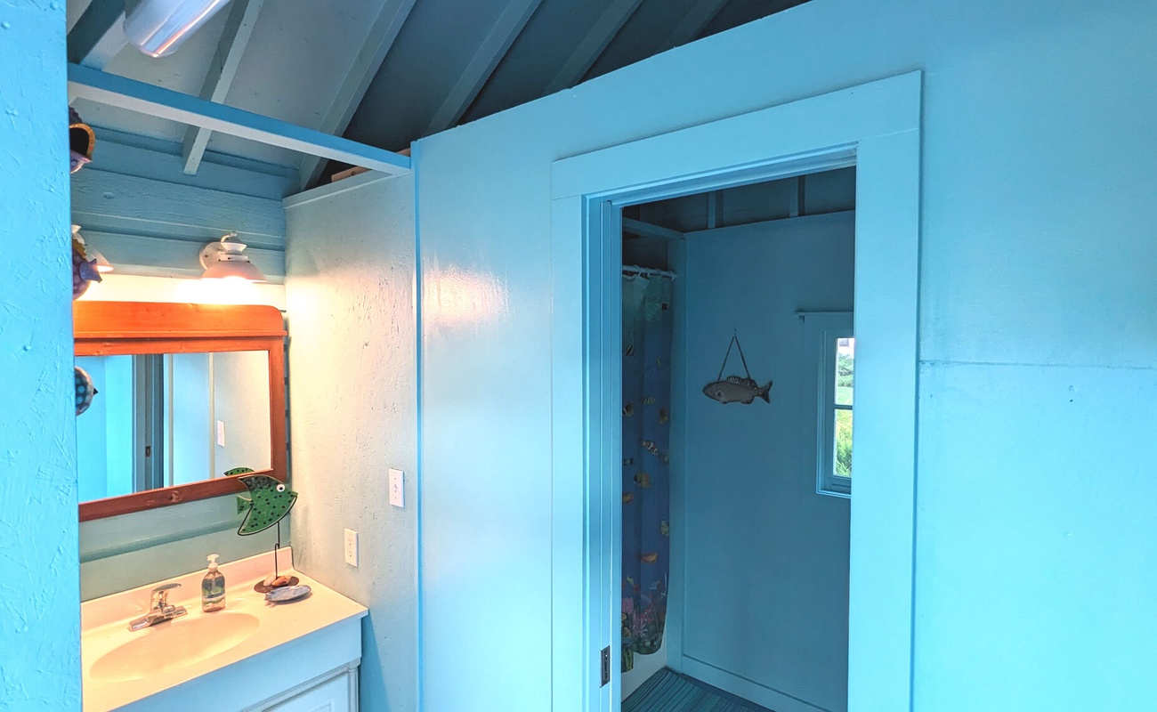 Get pool-ready or wash up in this playful, ocean-inspired bathroom.