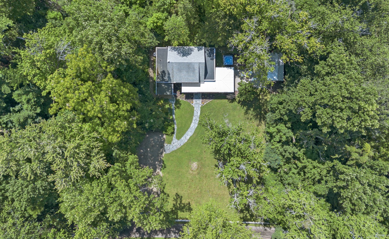 An aerial embrace of nature’s serenity and home’s comfort.