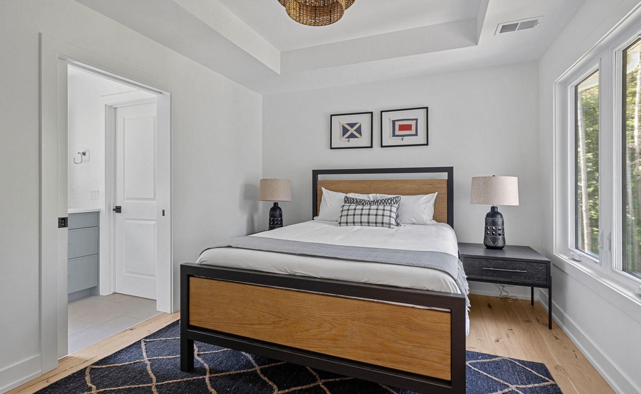 Bedroom 5 is on the main level & has a queen-size bed.