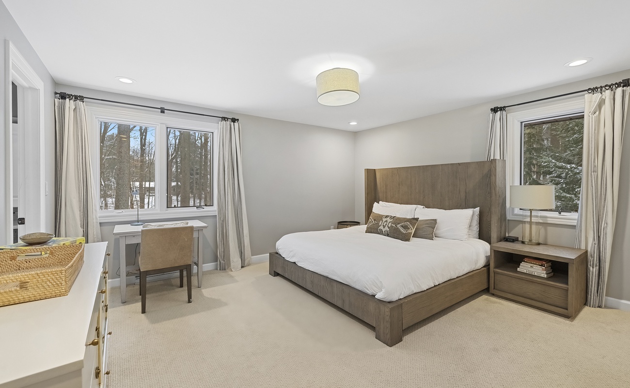 The primary bedroom is on the upper level and has a king-size bed + air mattress.