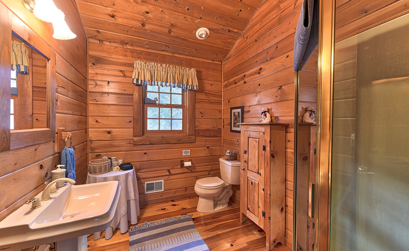 Immerse yourself in the cozy charm of this bathroom.