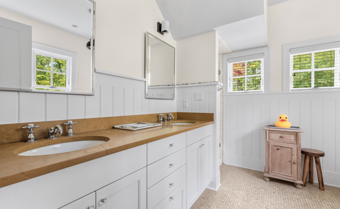 Double vanities, natural light, and one happy little duck.