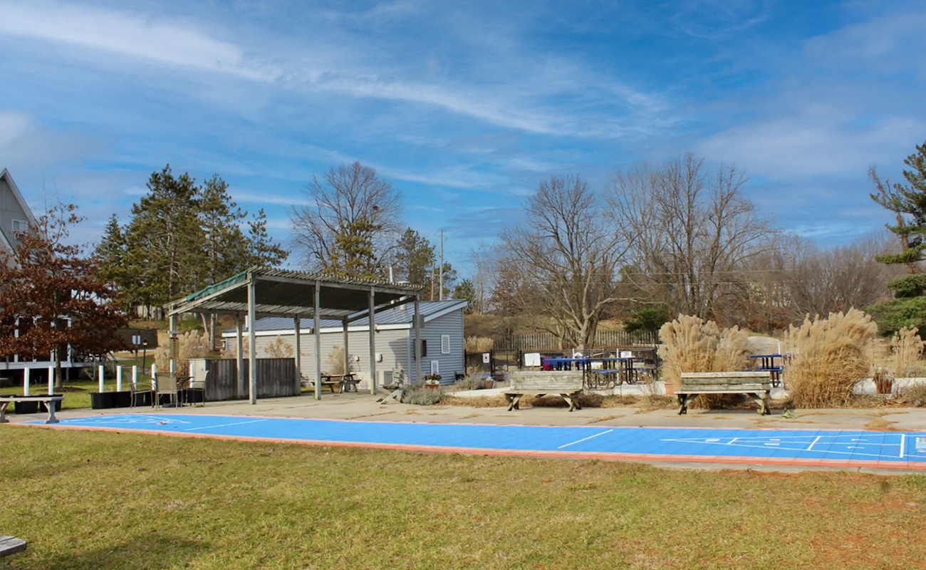 Lazy chalet days with shuffleboard, sunshine, and open-air lounging.